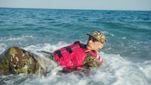 Miltary marine american man training in winter cold water