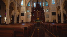 The inside of the church is new with empty pews. Dolly shot
