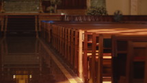 There was a streak of light shining on the pews in the church.