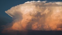 Deep Colours Fill the Sky as a Huge Storm Cloud Builds at Sunset Timelapse