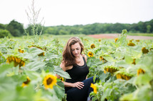woman in a field of sunflowers 
