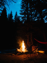 hammocks by a campfire 