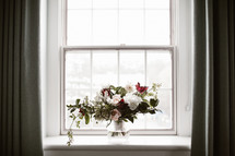flower arrangement in a window sill 