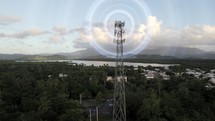 Aerial Up A Cell Phone Tower Over A Country Town.