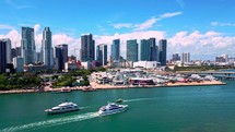 Tracking Shot of Yachts and Downtown Miami Skyline