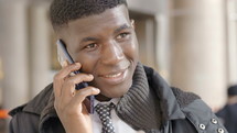 young man talking on a cellphone 