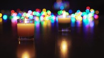 Candles and colored bokeh at night