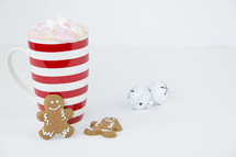 mug of hot cocoa and ginger bread cookies 