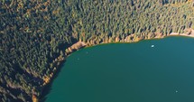 Autumn Scenery With Colorful Forest And Volcanic Lake, Lake Saint Ann In Romania - aerial drone shot