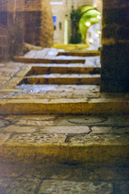 Stone steps to arched walkway in Israel