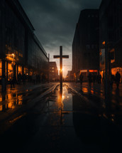 A cross set in the middle of the city just a sunset. 