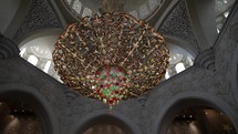 Large, beautiful chandelier inside Abu Dhabi mosque in United Arab Emirates. 