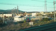 Traveling on a train in Europe, seen out the window and arriving at the station