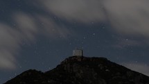 Time lapse of stars and a mountain top observatory