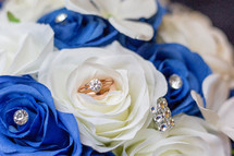 engagement ring and blue and white roses 