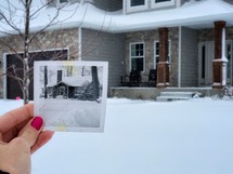 photograph of a house in snow 