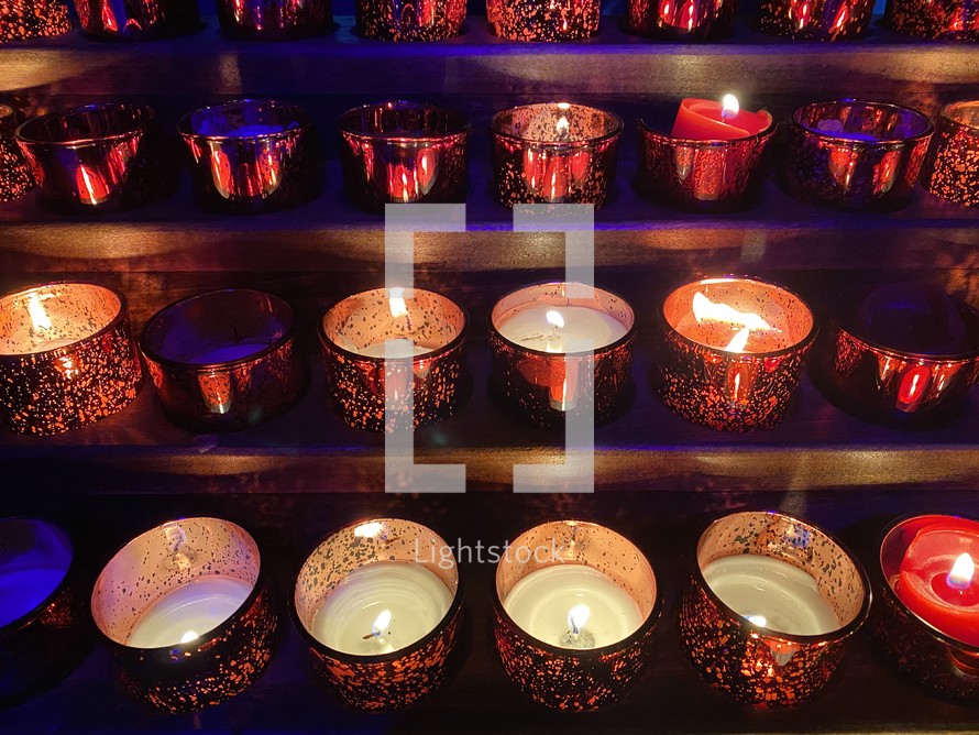 rows of prayer candles 