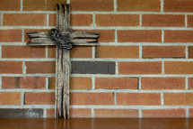 Cross on a brick wall