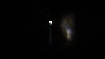 Model Lighthouse Beacon Rotating in a Dark Seascape