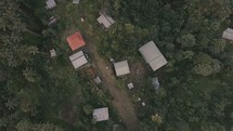 Aerial flyover of mountain village in Papua New Guinea, perfect for missions trip promo video.