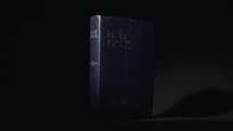 Light reveal to The Holy Bible with professional lighting