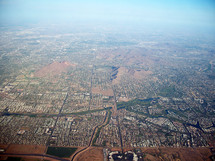 An Aerial Bird's eye View over the city of Phoenix, Arizona taken from an air plane in the southwestern United States. 
