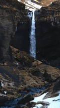 Waterfall Falling From Mountains In Winter Season