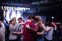 hugs during a worship service 