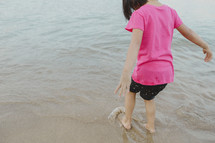 child playing on the beach 