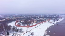 Veliky Novgorod Russia, aerial view of of ancient Kremlin fortress surrounded by snow during winter 4K drone shot