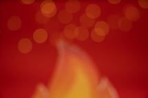 Bokeh flame and mini lights on a red background