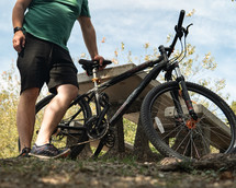 a man standing next to a dirt bike 