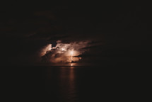 Lightning strike from a storm over the ocean 