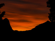 red sky at sunset and mountain peaks 