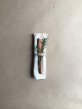 carrot and rosemary tied in a cloth
