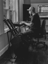 man writing music 