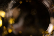 Abstract blurred golden confetti bokeh party background