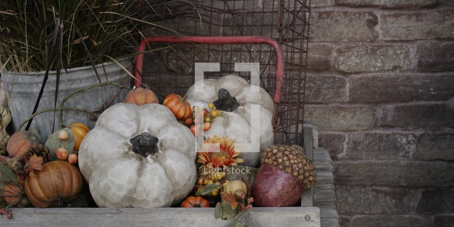 fall decorations in a wooden wagon
