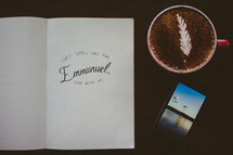 Book, cell phone, and a cup of coffee.