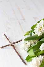 White hyacinth and tulips and cross