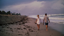 couple strolling on a beach 