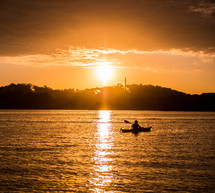 kayak on the water at sunset 