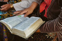 reading a Bible during a worship service 