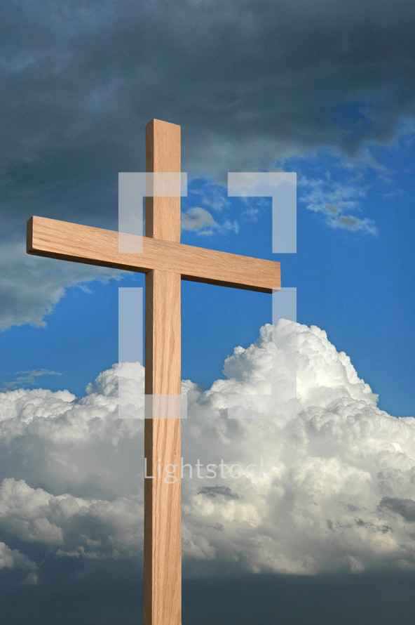 wood cross against a cloudy sky 