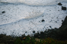 sea foam along a shore