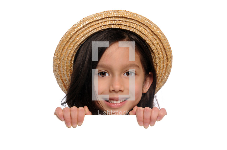 A young girl wearing a hat.