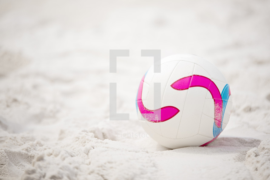 a volleyball in the sand 