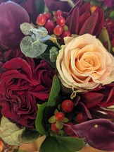 bouquet of maroon and cream roses 