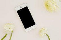 iPhone and white flowers 
