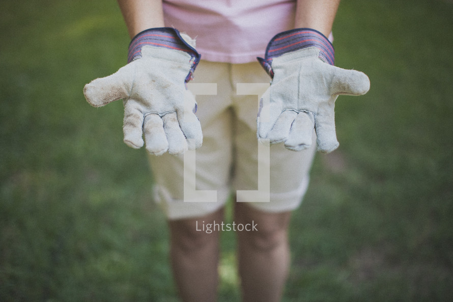 woman in work gloves